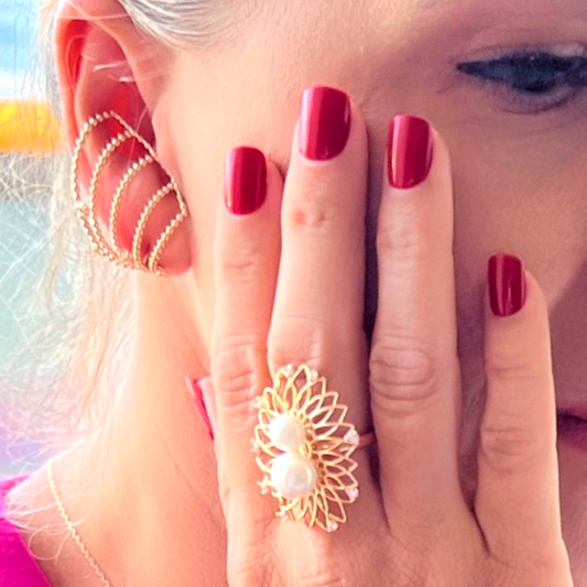 Accessorize with this ring and make a beautiful statement of style. It features a stunning pearls with a unique combination of tones and textures. The unique gold plated finish adds a timeless elegance to the ring.